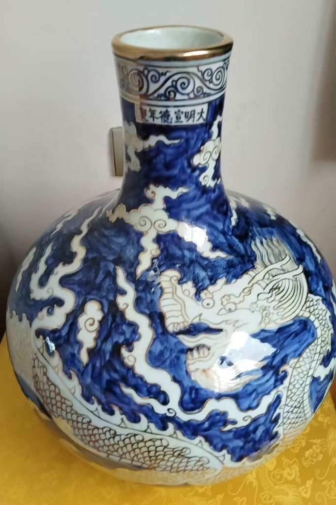 图片[1]-Ming Yongle blue and blue sea water dragon pattern flat bottle-国际艺术品交易网