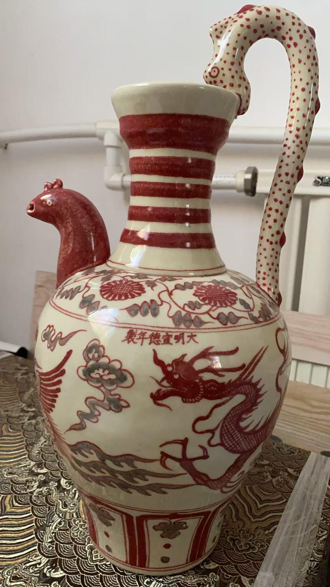 Ming Xuande glazed red dragon and phoenix chicken head pot-国际艺术品交易网